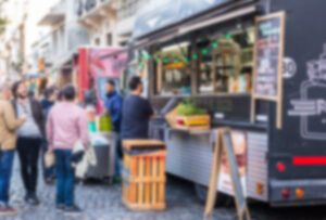 food truck with people buying food